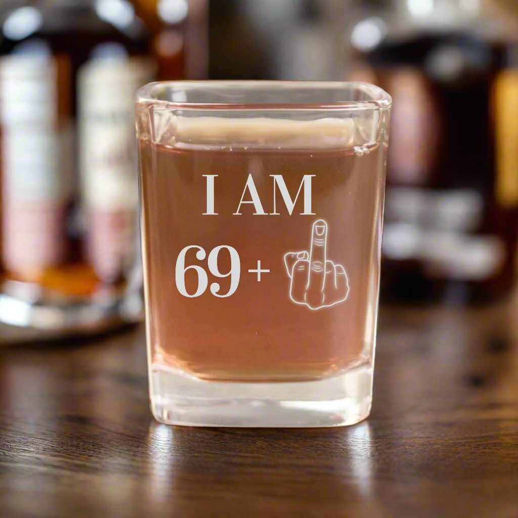 Funny 70th birthday shot glass engraved with I Am 69 plus middle finger