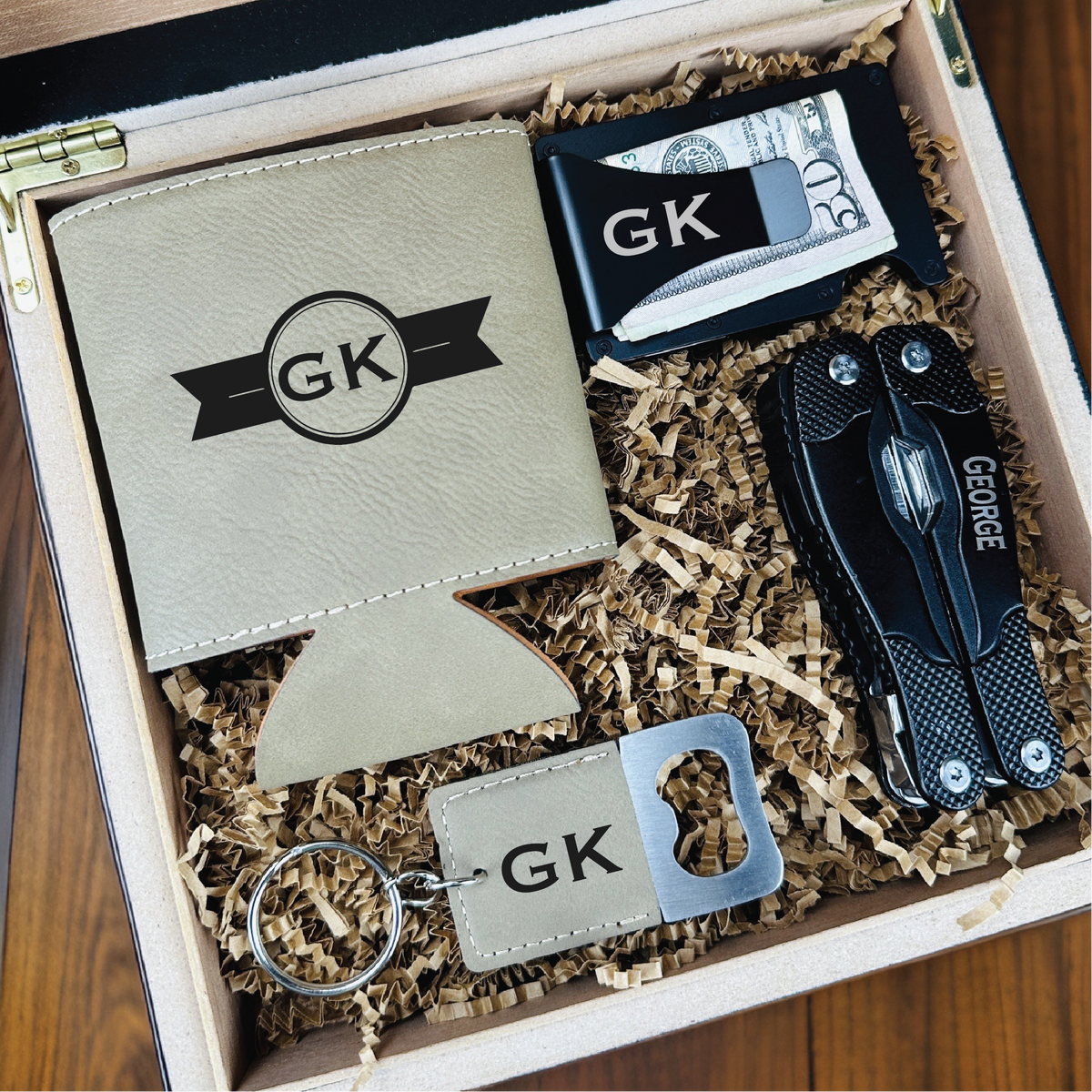 Personalized multitool gift set with engraved tools, custom wallet, bottle opener keychain, and leather koozie in a laser-engraved wooden gift box.