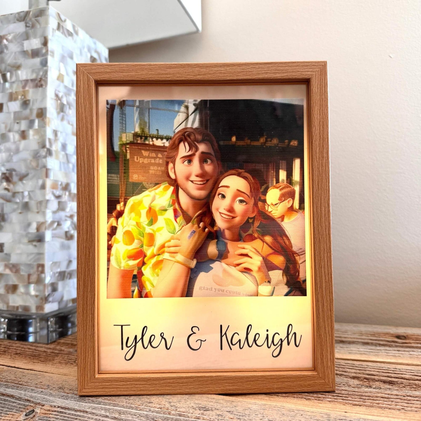 Custom animated-style couple portrait in a light-up photo box, personalized with names, making a unique and romantic gift for a boyfriend.