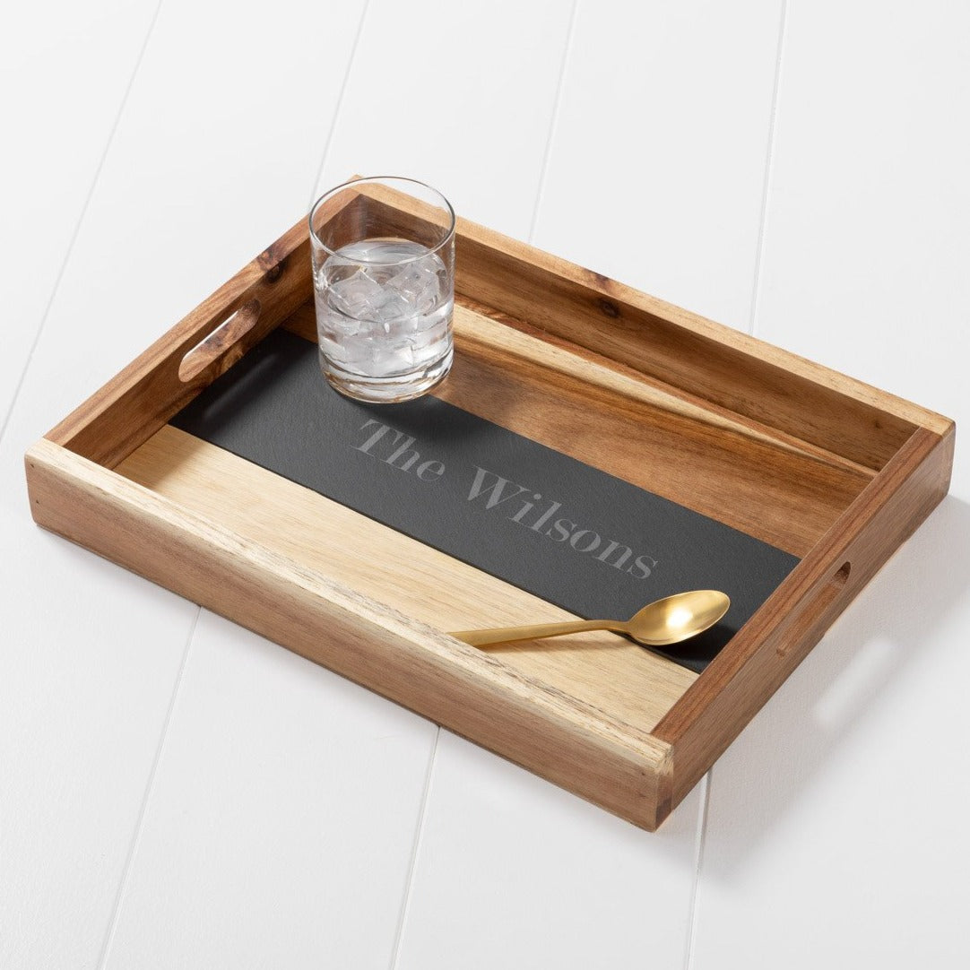 Personalized wooden serving tray with custom engraving on slate center,