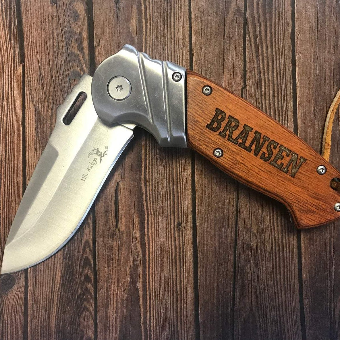 Engraved folding knife