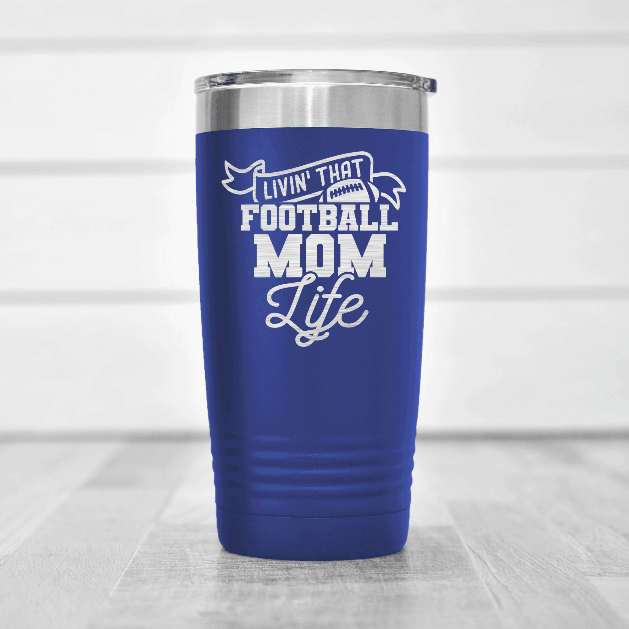 https://www.groovyguygifts.com/cdn/shop/products/The_Daily_Grind_Of_A_Football_Mom_Tumbler_Blue_2000x.png?v=1703332644